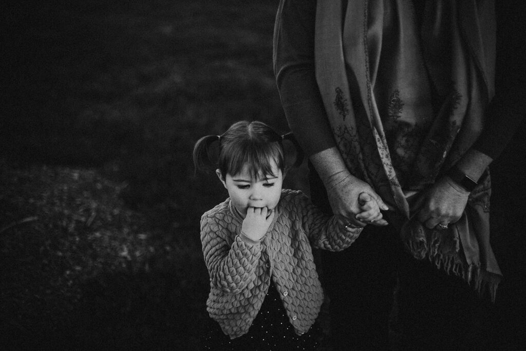 Grandmother holding granddaughters hand. Taken by Canberra family photographer Samara Gentle.